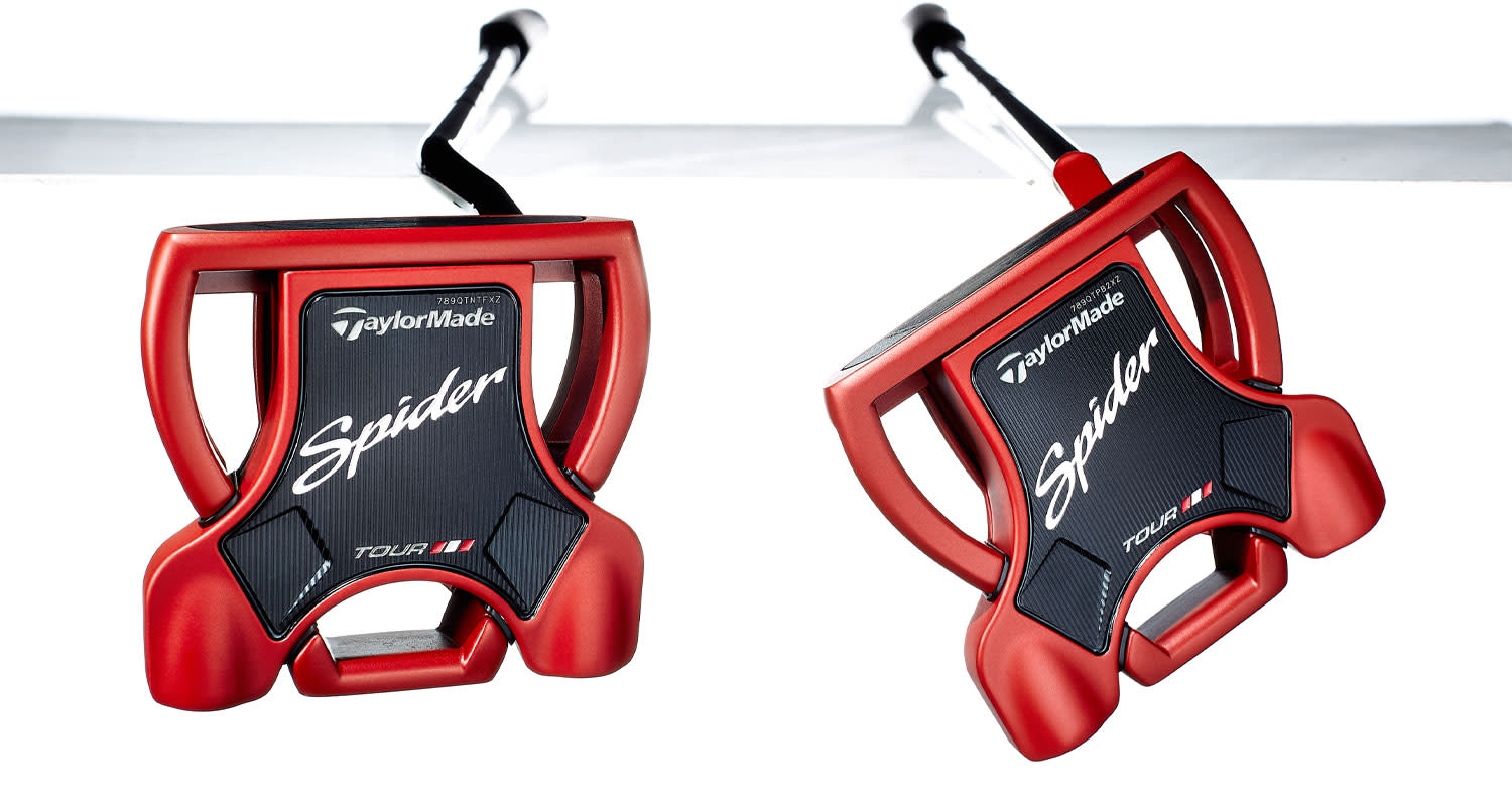 Two red TaylorMade Spider Tour golf putters lie side by side on a white background, with the logo and model name clearly visible.