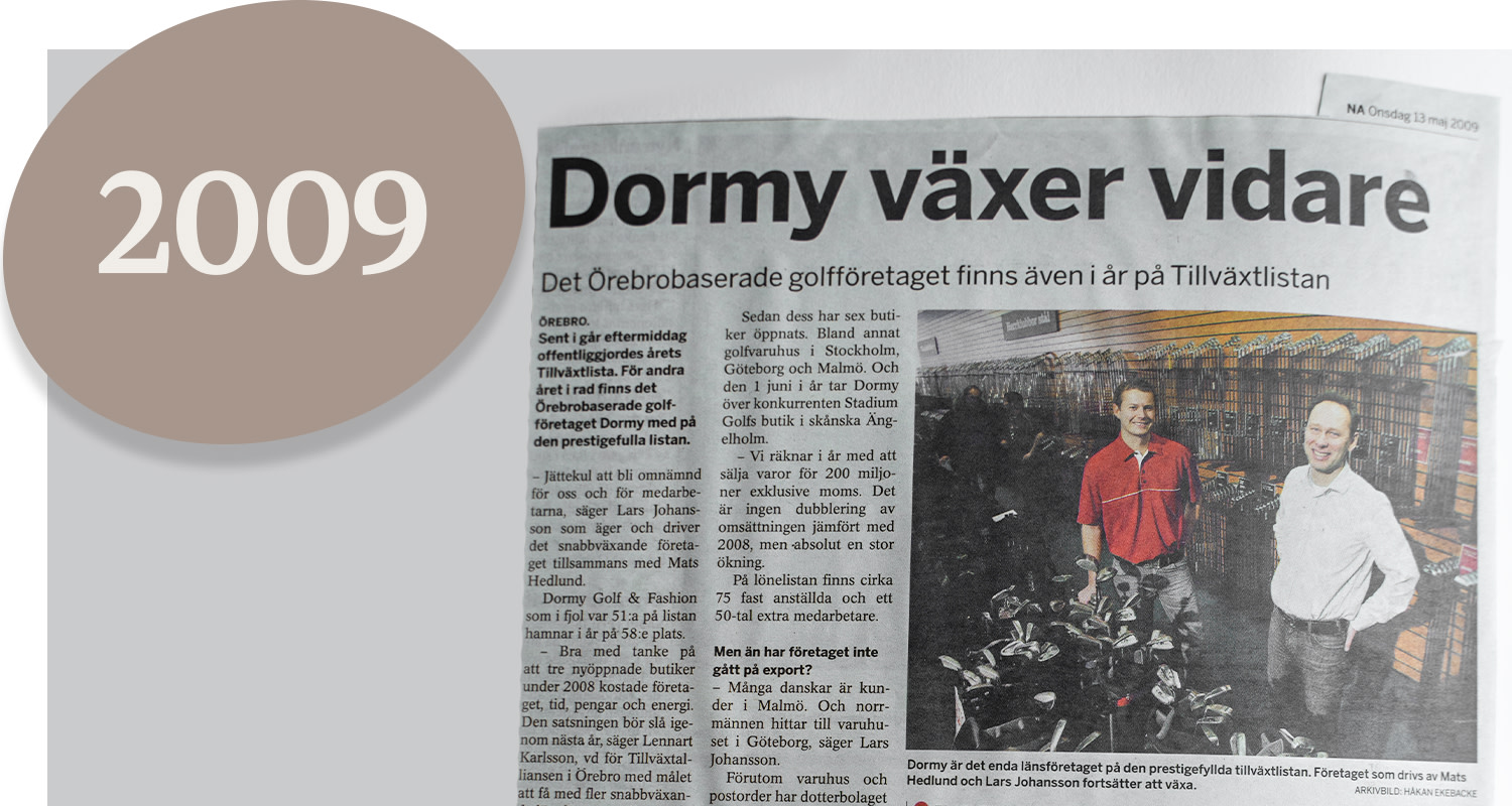 Newspaper article with the headline "Dormy continues to grow", two men are standing in a golf shop, large oval with the text "2009" to the left.